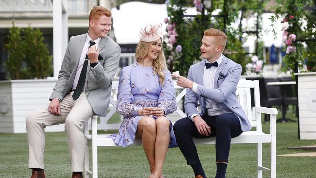 Keen racegoers Liam Gilleland, Kimberley Ireland and Curtis Gilleland. Picture: Richard Dobson