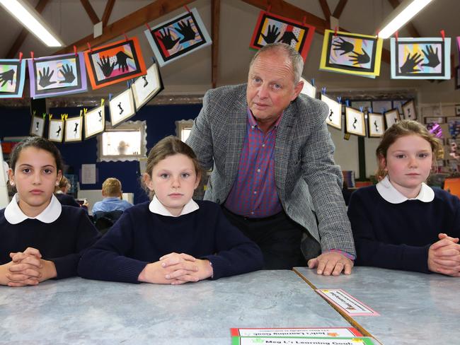 St Roberts year 4 students Monteya Criscione, Charlotte DeGrandi and Meg Lappin with principal Mark Soldani. Picture: Peter Ristevski