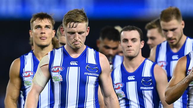 Jack Ziebell leads his team off after a giant loss on Good Friday.