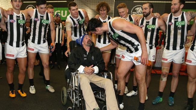 Murray Swinton with Collingwood players after Queen’s Birthday. Picture: Michael Klein