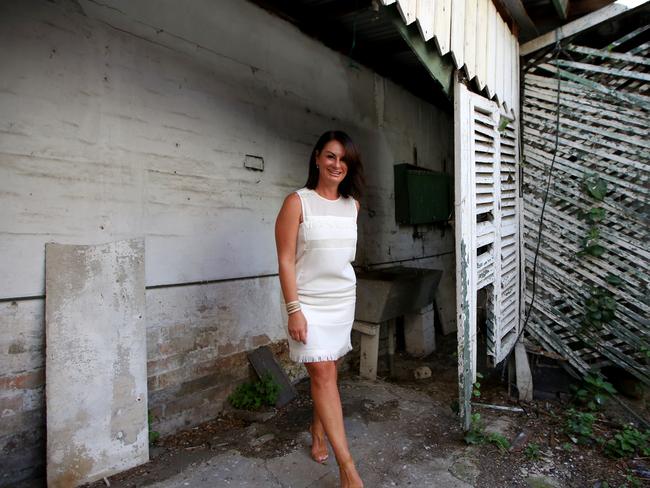 Real Estate Agent Corrinne Olsen at a Surry Hills dump she sold. Picture: Tim Hunter.