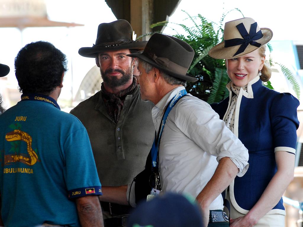 Hugh Jackman, Nicole Kidman and director Baz Luhrmann meet local Aboriginal elders for a traditional welcome on the Bowen set of film Australia.