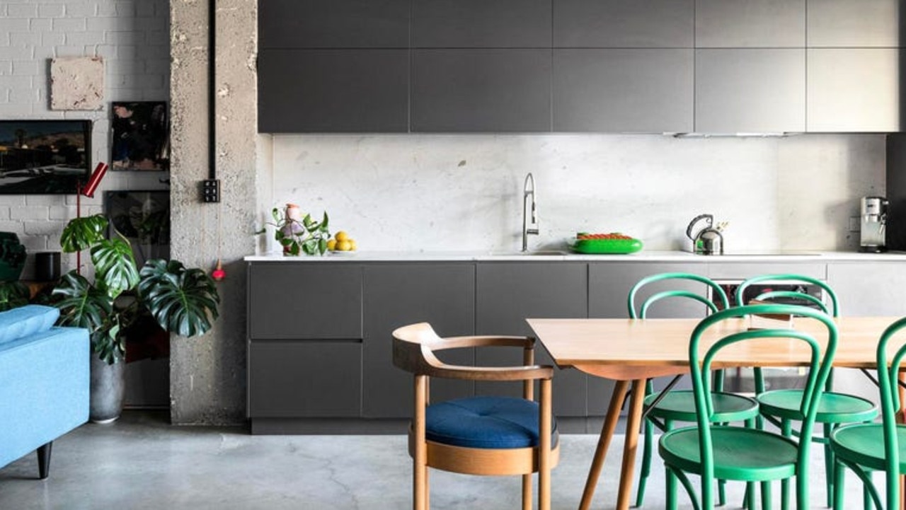Polished concrete floors and bright pops of colour add to the artistic feel.
