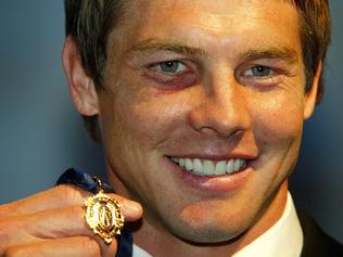 SPORT Brownlow medal winner Ben Cousins holds the 2005 medal at the dinner at Burswood Casino, Perth.