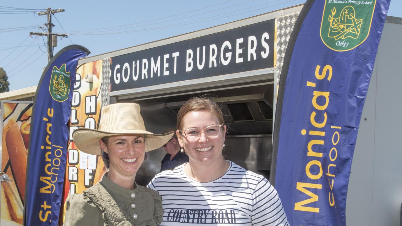 Leah Chicken and Meg Bullock at the St Monicas Catholic Primary School P &amp; F chip van at the 115th Oakey Show. Picture: Nev Madsen.