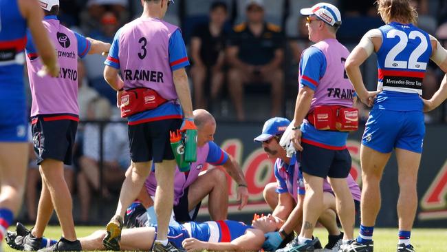 Liam Picken is helped by medical staff after a concussion. Picture: Getty Images