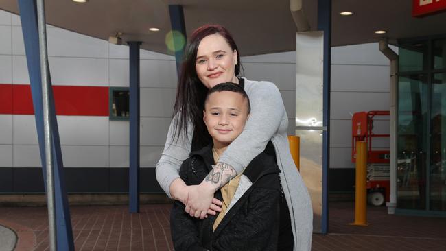 Pictured outside Campbelltown Hospital Kathleen Warren with her son Cohen Leota-lu (8). Cohen was transferred to Randwick Hospital for surgery due to a lack of specialist services, meaning Kathleen had to commute to Sydney during treatment. Picture: Richard Dobson