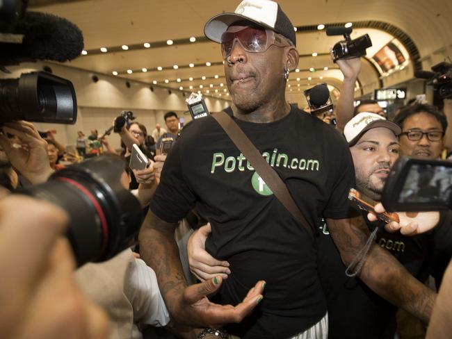 Former NBA basketball player Dennis Rodman arrives at Beijing after a flight from Pyongyang. Picture: AP Photo/Mark Schiefelbein