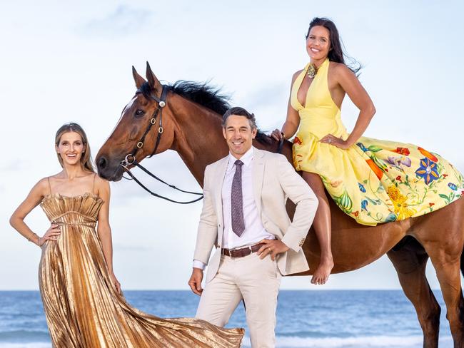 Kate Waterhouse with Billy and Nicole Slater and horse Bruce ahead of Magic Millions. Picture by Luke Marsden.Magic Millions have added a twilight race at the start of the carnival. Here's a frame of Kate Waterhouse and Billy and Nicole Slater with a horse on the beach to announce it.