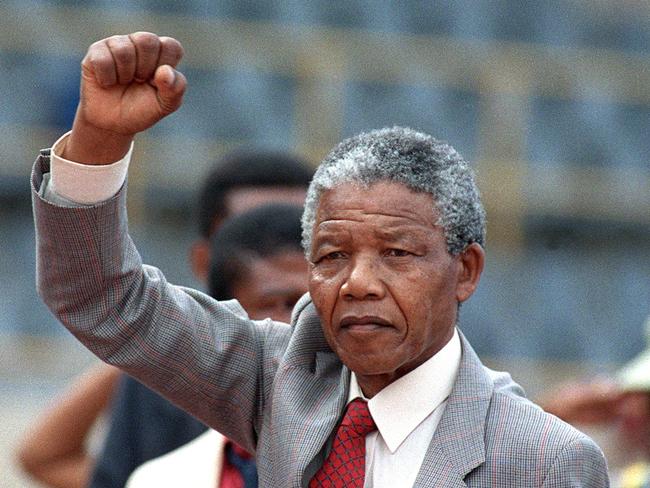 Anti-apartheid leader Nelson Mandela raises a clenched fist as he arrives to address a mass rally on February 25, 1990, a few days after his release from jail. Picture: AFP/ Trevor Samson