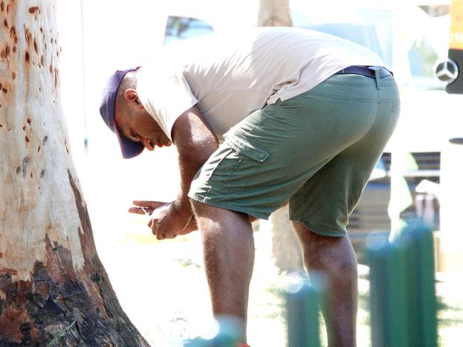 A man engages in drug use just outside the injecting rooms. Picture: Alex Coppel.