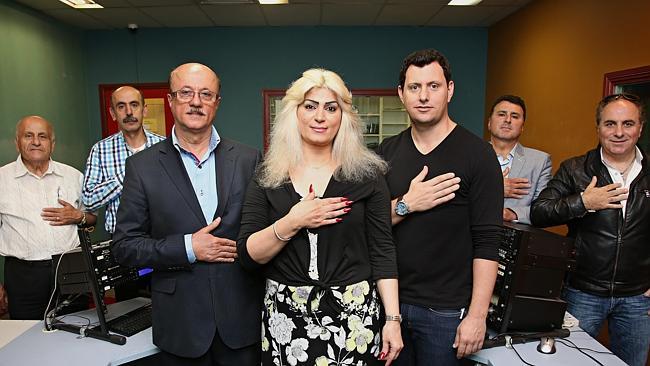 Antoine Lattouf, left, Francois Gitani, Alaa Alawadi, Joumana Gebar, Johnny Merheb, Raymond Bouassi and Bedro Hajje singing the Australian national anthem on Sydney’s 2000 FM. Photographer: Adam Yip