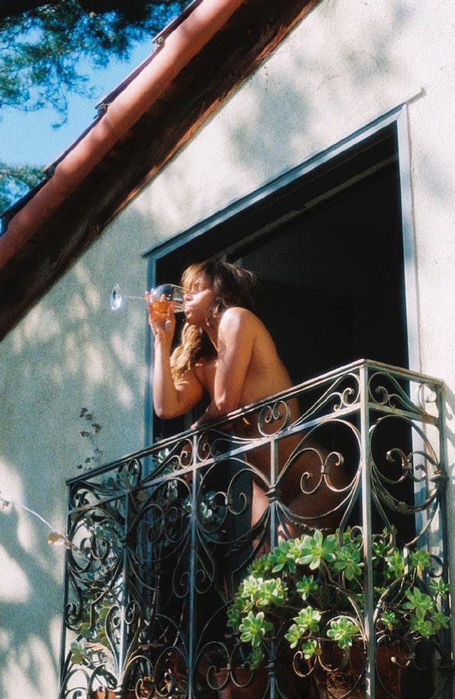 A naked Halle Berry drinks wine on her balcony. Picture: Instagram/halleberry