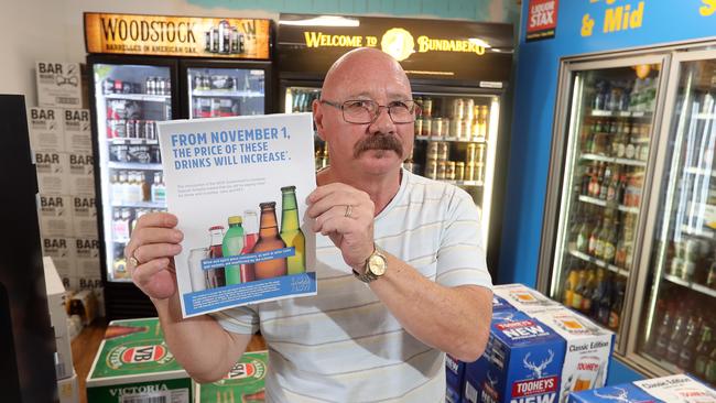 Beer prices are up in NSW due to a new recycling scheme. Bottle shop manager Dave Gordon. Photo by Richard Gosling