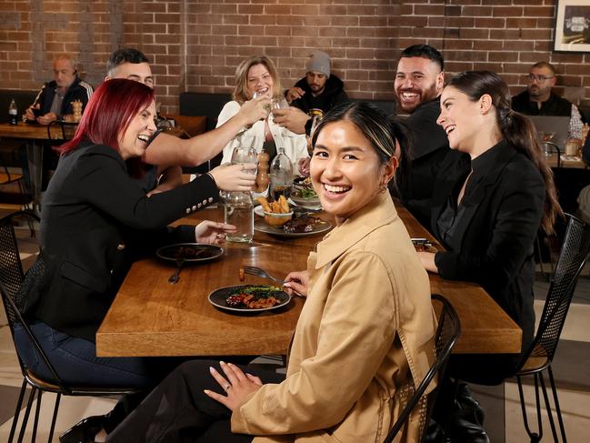 Diners are flocking back to restaurants across Sydney now vaccination rates against Covid 19 have hit 70 percent. Diners at Butcher's Block in Granville L-R Chantelle Chapman, Jake Sleiman, Samantha Sleiman, Tyson Kini, Mia Donatelli and Jessica Hombre (front) enjoy a meal at lunchtime. Picture: Toby Zerna