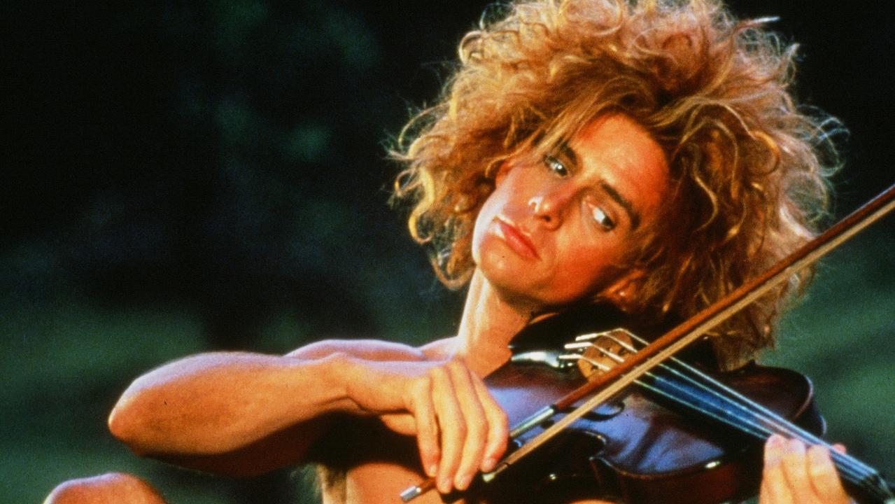 Yahoo Serious plays a violin in a scene from the Warner Bros movie Young Einstein. Picture: Getty.