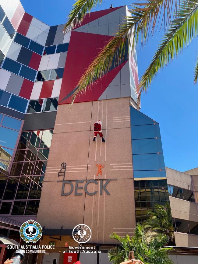 Excited gasps from patients and their families were heard at the Women’s and Children’s Hospital (WCH) when Santa abseiled a building to join police at a magical Christmas party. Picture: SA Police