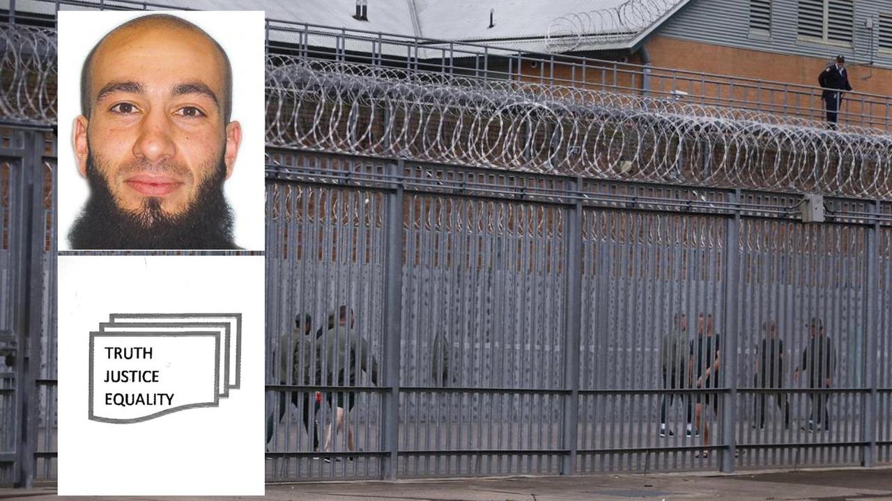 Bassam Hamzy works on his branding behind bars