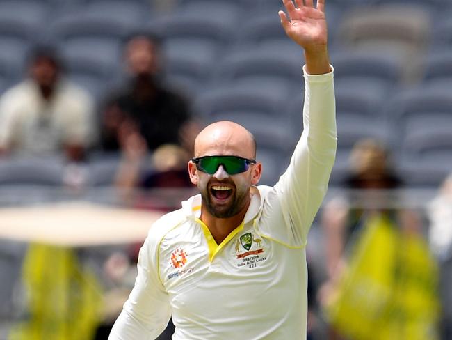 Australia's Nathan Lyon celebrates having India's batsman Ajinkya Rahane caught behind by  Tim Paine in the second Test in Perth. Picture: AFP 