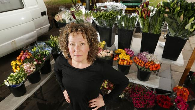 Lisa Marmur even brings water from home for her flowers, emptying them onto trees in the park at the end of the day. Picture: Norm Oorloff