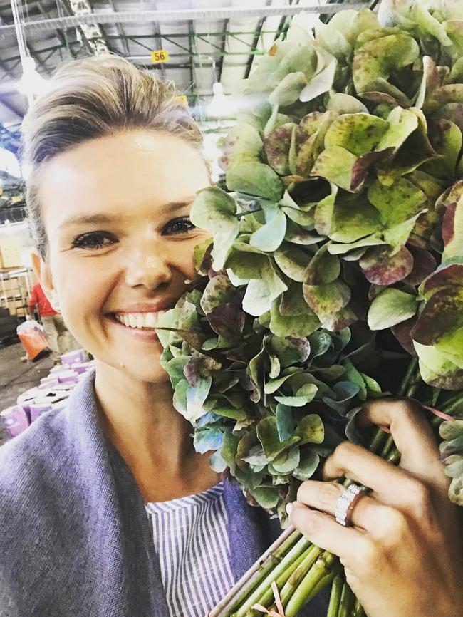 Newly engaged Edwina Bartholomew shows off her ring ... “*fingers hidden in flowers because all my nail polish is chipped at the one time everyone actually wants to see my hand xxxx” Picture: @edwina_b/Instagram