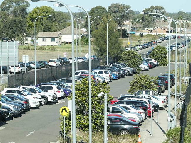 Commuters park along the road near Schofields train station. Some walk as much as a kilometre to the station.