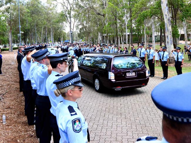A hearse passes the guard of honour at the memorial service with full police honours for constables Rachel McCrow and Matthew Arnold at Brisbane Entertainment Centre. Picture: David Clark
