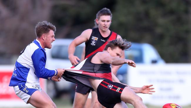 Irrewarra-Beac’s Christopher Dunne is tackled by South Colac’s Joshua Woods.