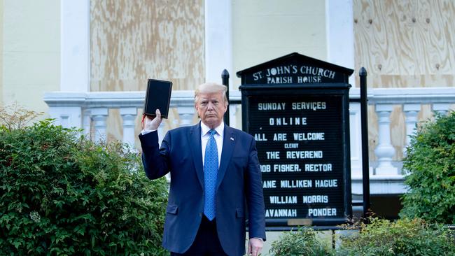 US President Donald Trump holds a Bible while visiting St John's Church across from the White House. Picture: AFP