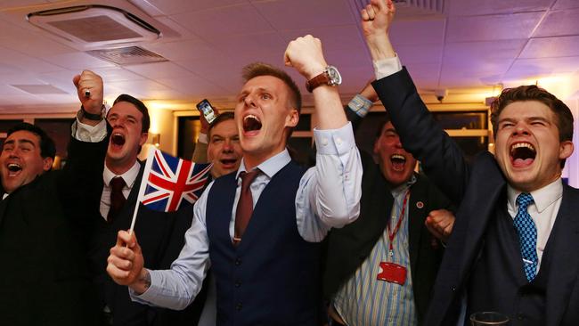 Leave EU supporters wave Union flags and cheer as the results come in. Picture: Geoff Caddick/AFP