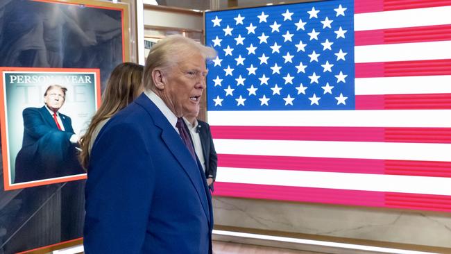 President-elect Donald Trump arrives on the floor of the New York Stock Exchange after ringing the opening bell on Thursday in New York. Picture: AP