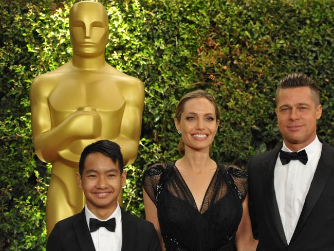 Maddox Jolie-Pitt, Angelina Jolie and Brad Pitt, on the red carpet at the 2013 Governors Awards, in Los Angeles. Picture: John Shearer/Invision/AP