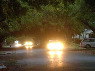 Woongarra Street lit by car headlights. 