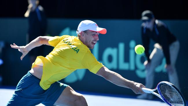 John Millman at full stretch against Bosnia-Herzegovina at Memorial Drive. Picture: AAP Image/David Mariuz