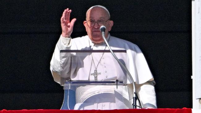 Pope Francis waves to the crowd from the window of the Apostolic Palace overlooking St. Peter's Square on January 1. Picture: AFP