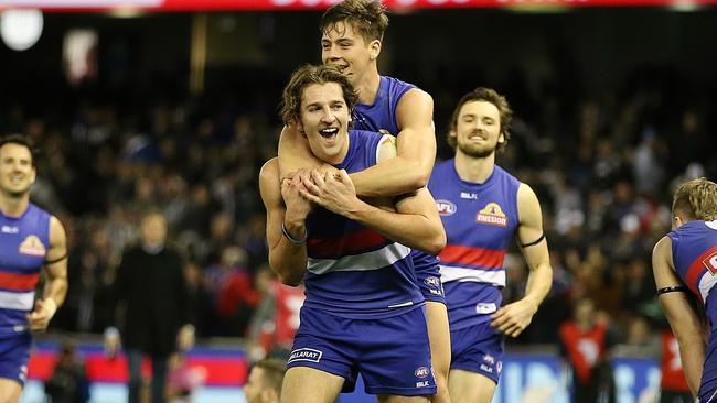 Marcus Bontempelli celebrates with Josh Dunkley after the Bulldogs’ escaped with victory. Picture: Wayne Ludbey