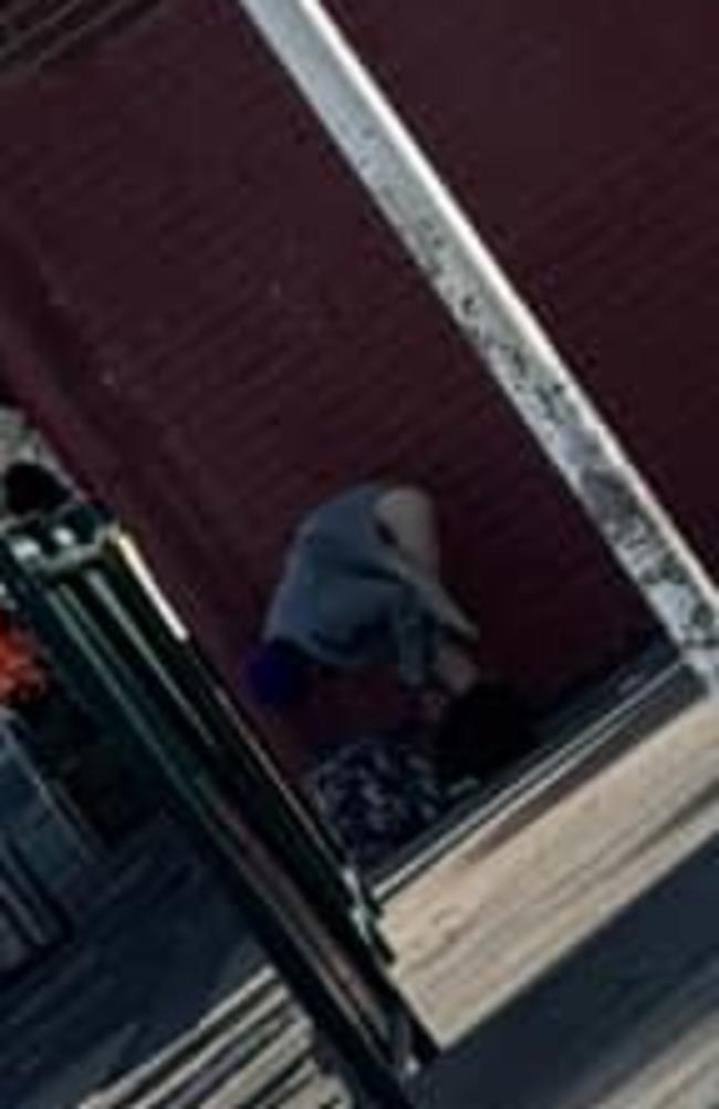 The horrified witness caught the masked man pulling his pants down to defecate in front of Flemington Primary School on camera. Photo: Supplied