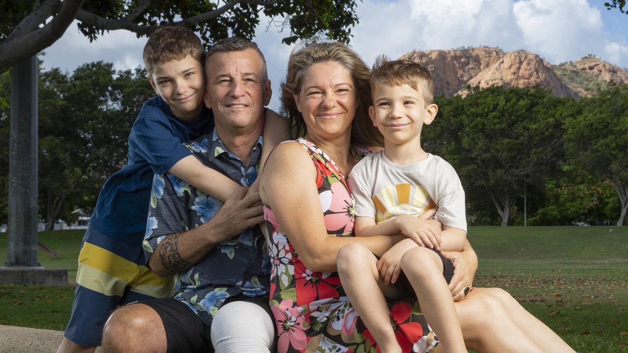 Shark attack survivor Rick Bettua with wife Angela and sons Troy 10, and Derek 6, in Townsville. Picture: Lachie Millard