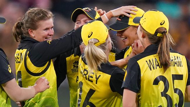 Jess Jonassen and the Aussies celebrate another wicket in their incredible win over India on Sunday. Picture: AAP Image/Scott Barbour