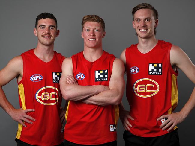 Sam Flanders (L - Pick 11), Matthew Rowell (Pick 1) and Noah Anderson of the Gold Coast Suns (R - Pick 2) pose for a photo during the 2019 NAB AFL Draft at Marvel Stadium on November 27, 2019 in Melbourne, Australia. (Photo by Dylan Burns/AFL Photos via Getty Images)