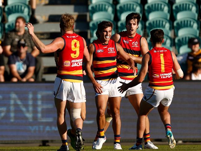 LAUNCESTON, AUSTRALIA - APRIL 23: Darcy Fogarty of the Crows (centre) celebrates with teammates after kicking the winning goal during the 2023 AFL Round 06 match between the Hawthorn Hawks and the Adelaide Crows at UTAS Stadium on April 23, 2023 in Launceston, Australia. (Photo by Michael Willson/AFL Photos via Getty Images)