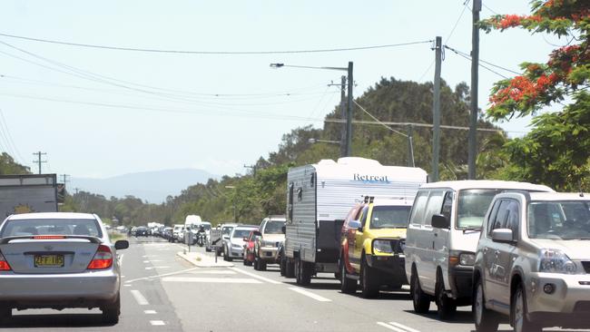 Traffic has been as busy as ever in Byron Bay, but visitor numbers are expected to have dramatically dropped this year because of the pandemic. Photo Marc Stapelberg / The Northern Star