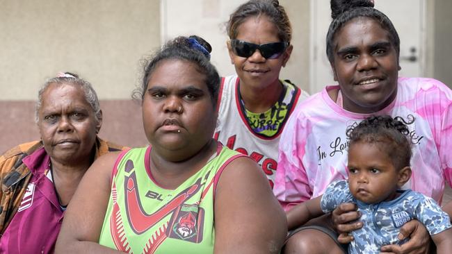 Doomadgee women Olive Roberts, Evelyn Ned, and Paula and Denise Booth, whose sister Betty died as a consequence of rheumatic heart disease and is one of three women whose deaths are subject to a coronial inquest, pictured with youngster Joel Ned-Anderson outside Cairns courthouse. Picture: Bronwyn Farr.