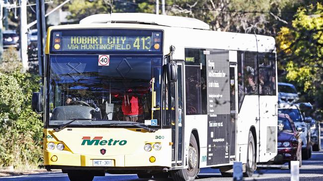 A crowded school bus arrives at Hobart College – with one student being forced to stand next to the driver.