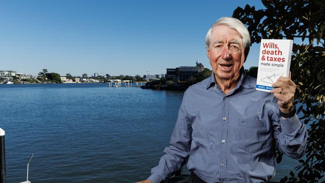 Brisbane financial guru Noel Whittaker at home with his new book. Picture Lachie Millard