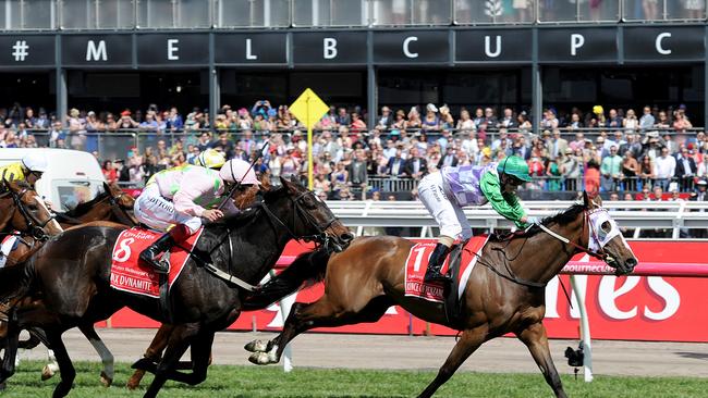 Jockey Michelle Payne riding Prince Of Penzance crosses the finish line to win the $6,000,000 Melbourne Cup race at Flemington Racecourse in Melbourne, on Tuesday, Nov. 3, 2015.(AAP Image/Joe Castro) NO ARCHIVING, EDITORIAL USE ONLY