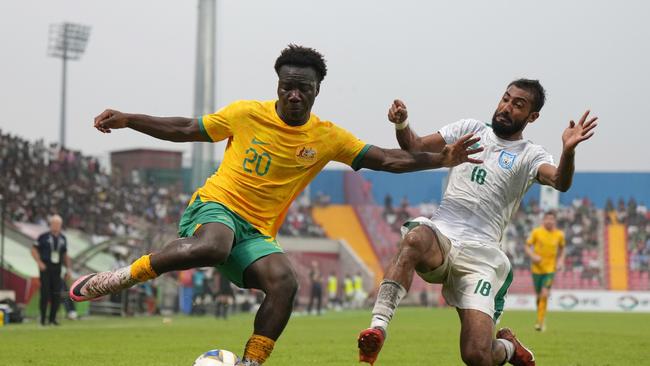 Socceroos debutant Nestory Irankunda (left) tries to get the better of Bangladesh’s Isa Faysal. Picture: Thananuwat Srirasant/Getty Images