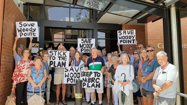 Residents gather outside of the Moreton Bay Regional Council Strathpine office ahead of council voting on Traders in Purple's development application for 2 and 8 Gayundah Esplanade, Woody Point. Photo Erin Smith