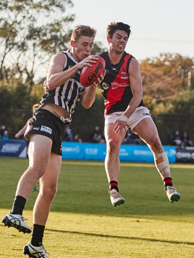 Port's Todd Marshall marks in front of West's Hugh Haysman at Alberton Oval. Picture: MATT LOXTON