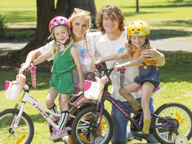 Western Bulldog player Liam Picken and partner Annie Nolan with their four-year-old daughters Cheska and Delphi. Picture: Rob Leeson